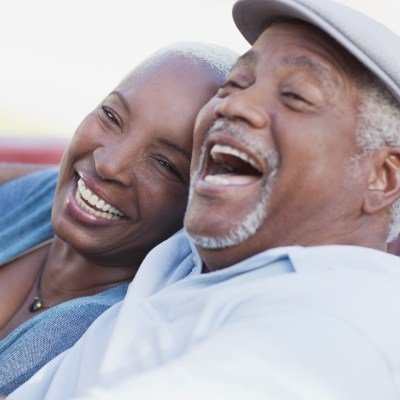 Laughing couple with dental implants in Reynoldsburg 